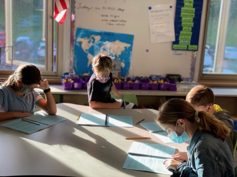 Students reviewing their handbooks during "Drop Everything and Advise"