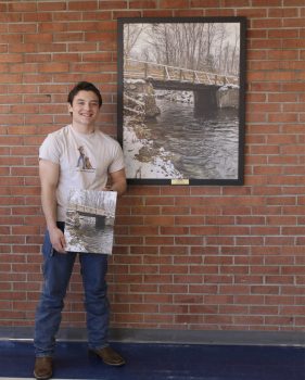 Christian Nolan is honored for his ASPIRE artwork entitled "Bridge to Tranquility."